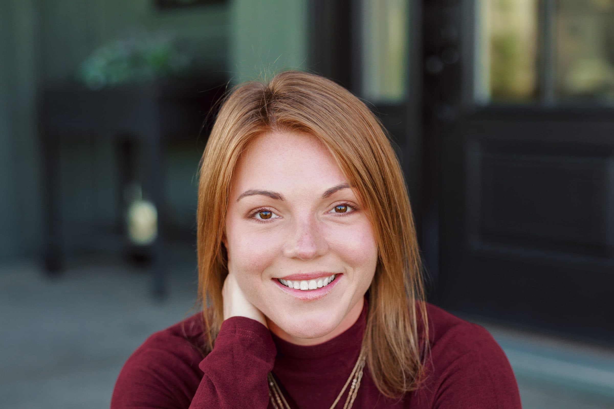 Jenna Gray, Dayton realtor, outside a home in the Dayton area
