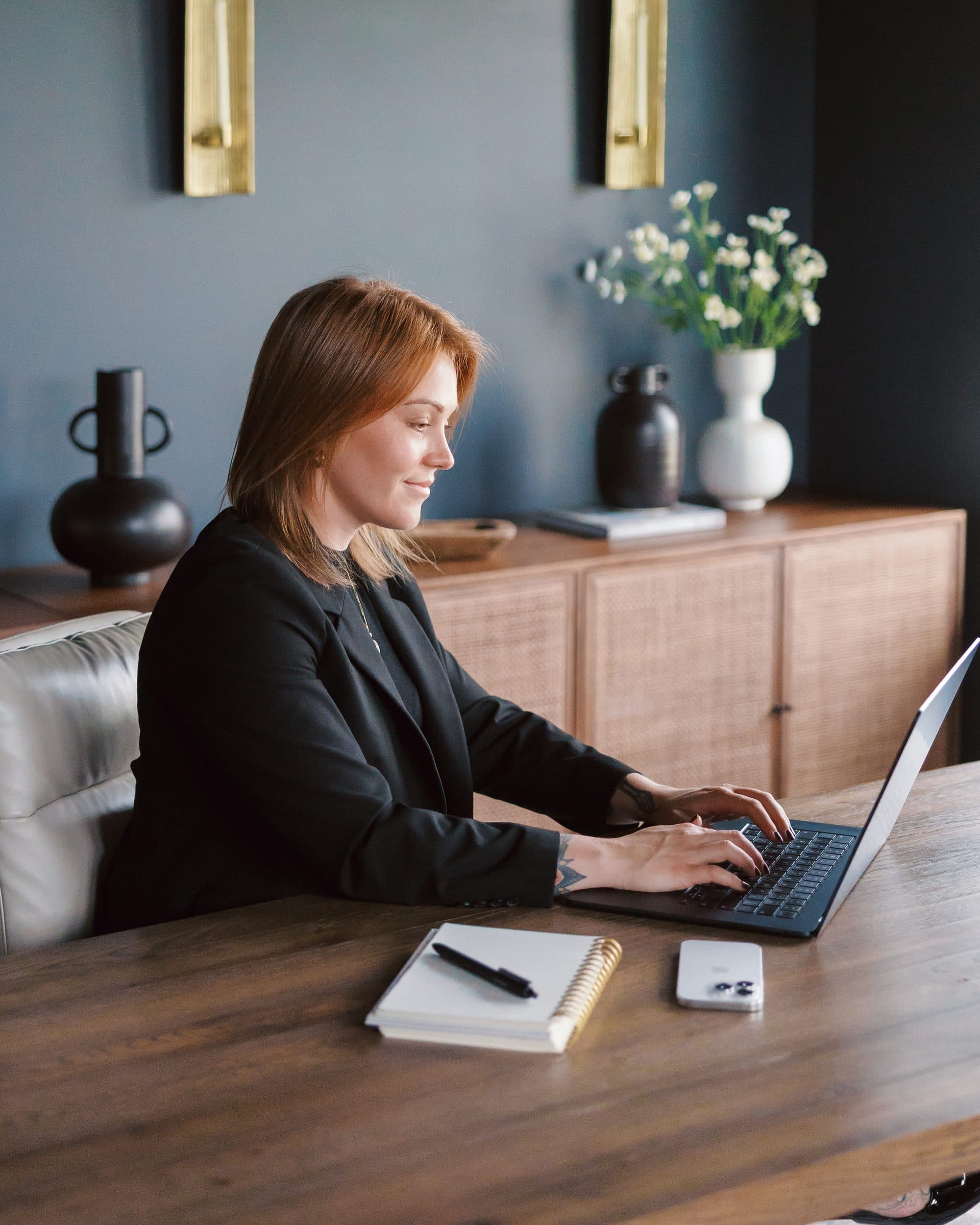 Jenna Gray, Dayton realtor, at her desk working through the numbers